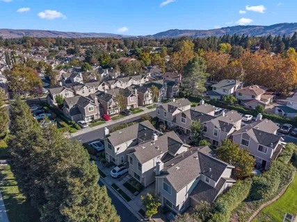 an aerial view of a house with a garden