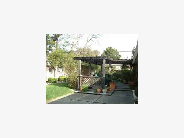 336 Springer Road Los Altos, CA 94024 - Photo 4 of 6 a view of a porch with furniture and garden