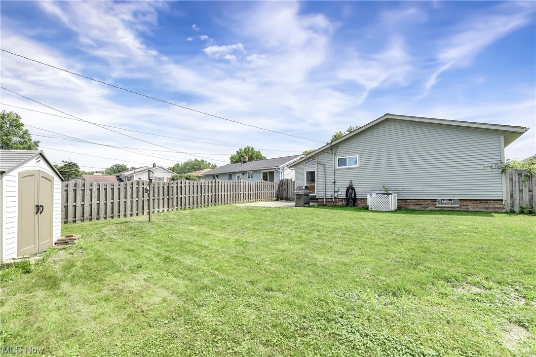 13678 Sheldon Road Brook Park, OH 44142 - Photo 34 of 35 Spacious Fully Fenced Backyard - Perfect For Entertaining Or Relaxing.