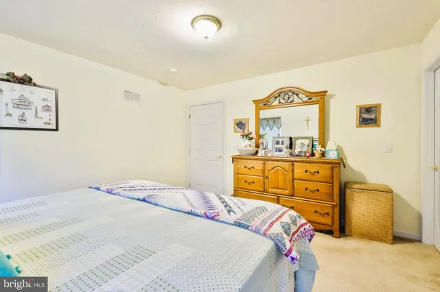 a bedroom with a bed and with furniture