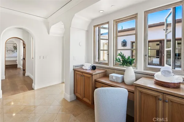 a living room with furniture and windows