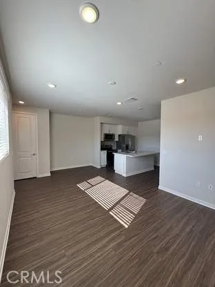 a kitchen with sink and stainless steel appliances
