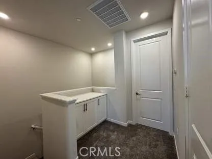 a bathroom with a double vanity sink and mirror