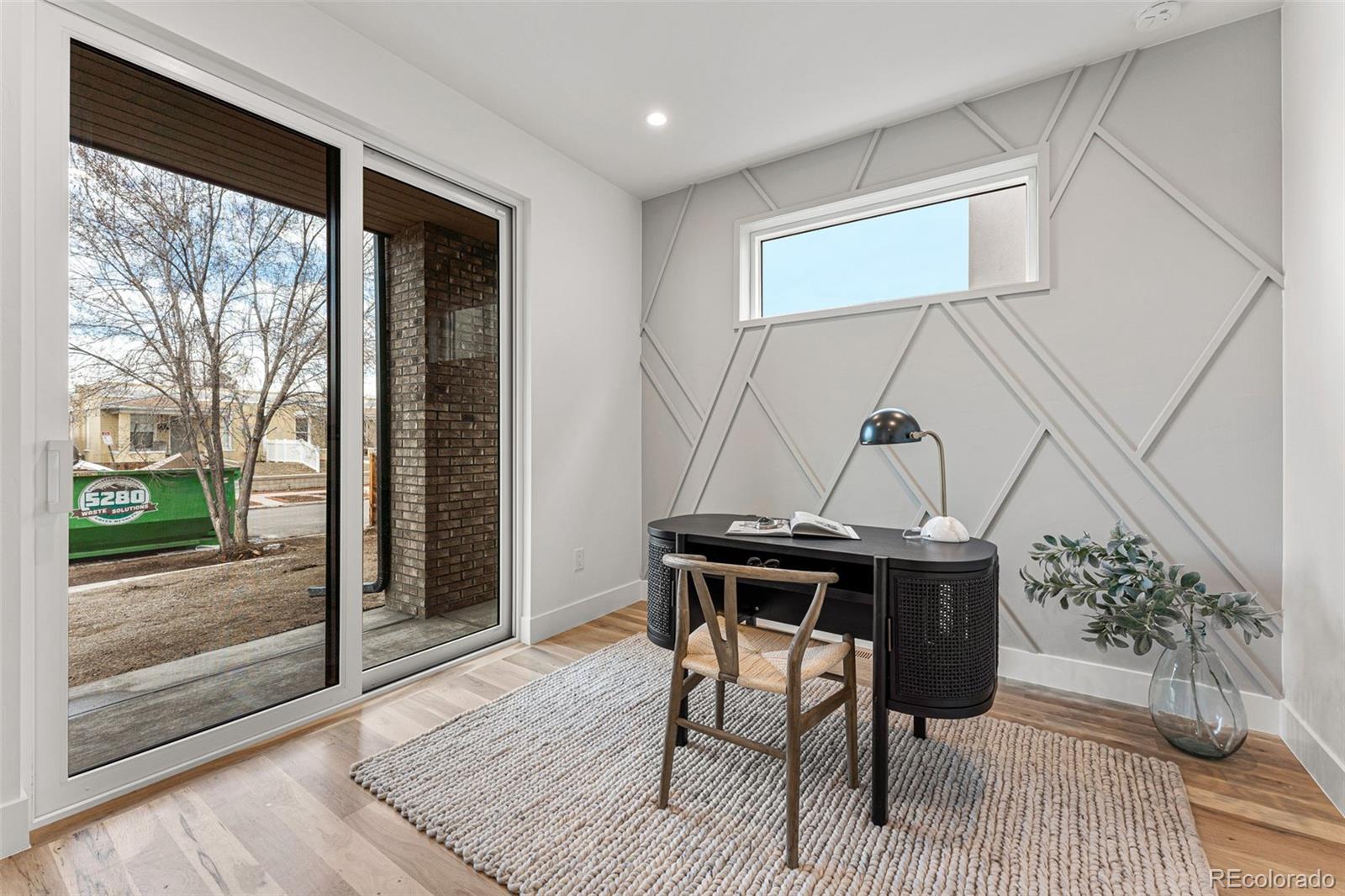 2410 South Bannock Street Denver, CO 80223 - Photo 16 of 40 a view of a livingroom with furniture and window