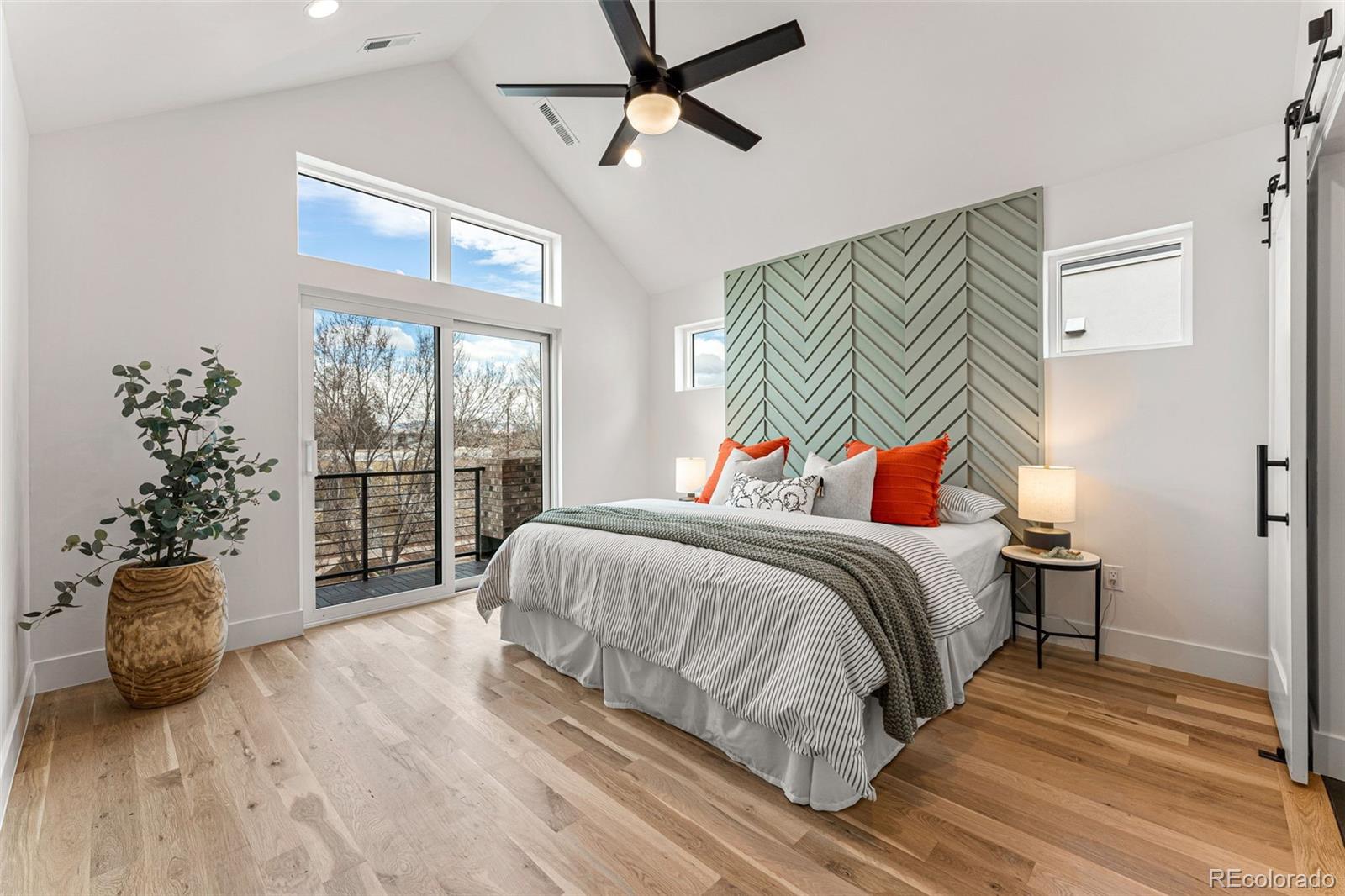 2410 South Bannock Street Denver, CO 80223 - Photo 20 of 40 a bedroom with a bed and a window