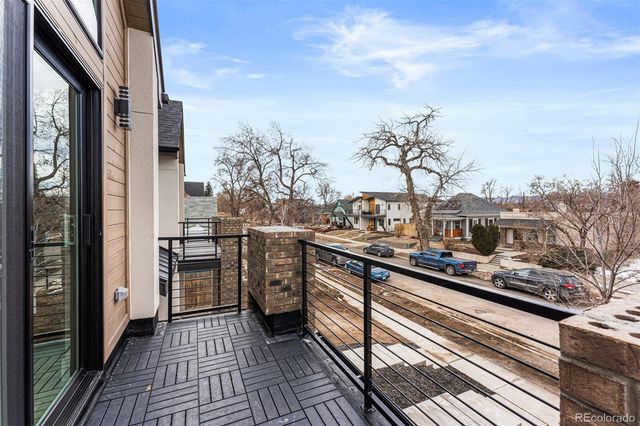 a view of a balcony with furniture