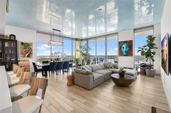 a view of a balcony with furniture and city view