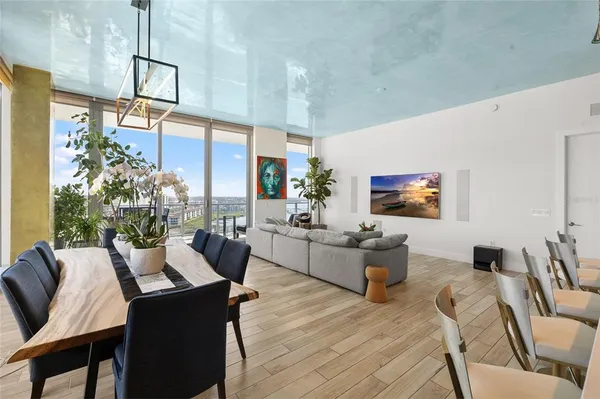 a room with furniture and screen tv