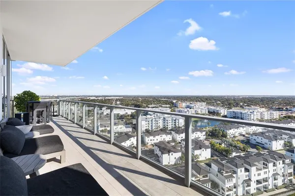 a view of a livingroom with workspace and a window