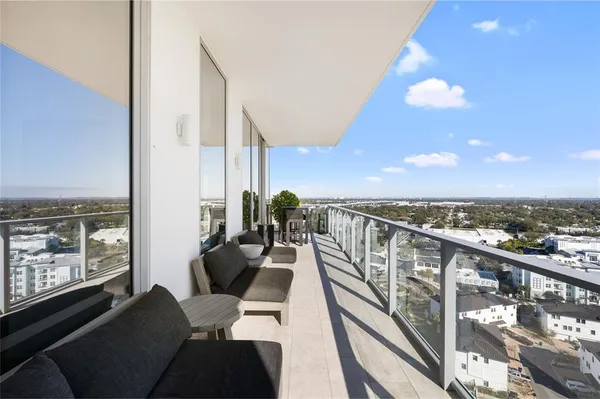 a view of a balcony with furniture