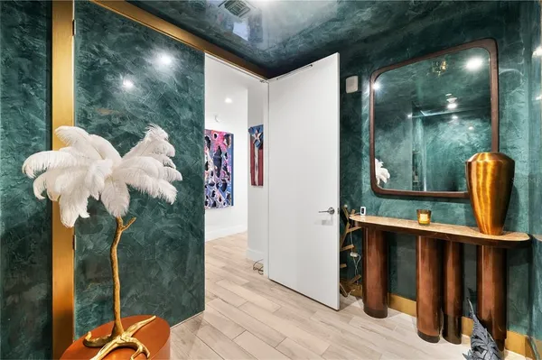 a living room with furniture a lamp and a potted plant