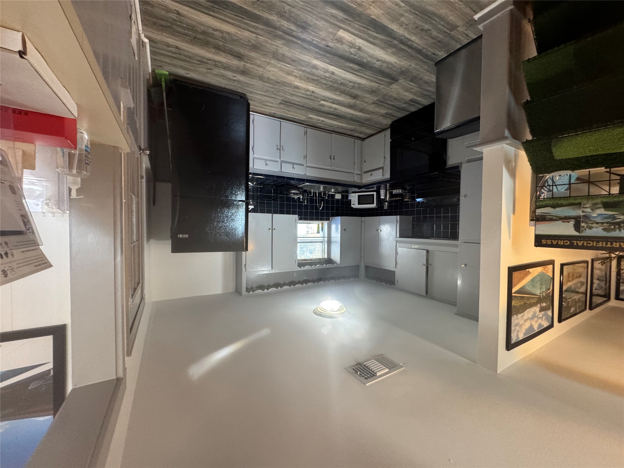 5300 Highway 290 Dripping Springs, TX 78620 - Photo 6 of 21 a kitchen with stainless steel appliances granite countertop a refrigerator and a stove top oven
