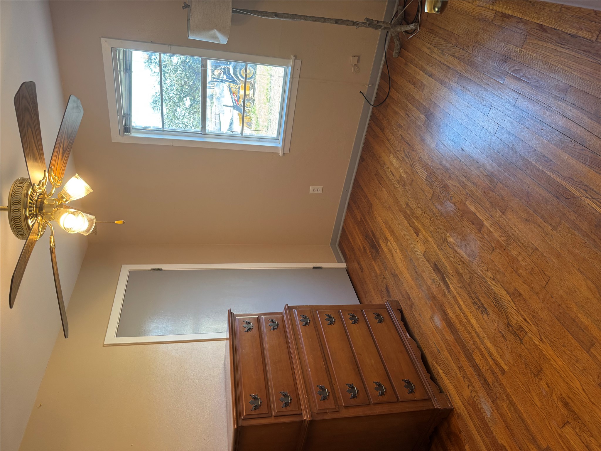 5300 Highway 290 Dripping Springs, TX 78620 - Photo 10 of 21 an empty room with wooden floor cabinet and windows