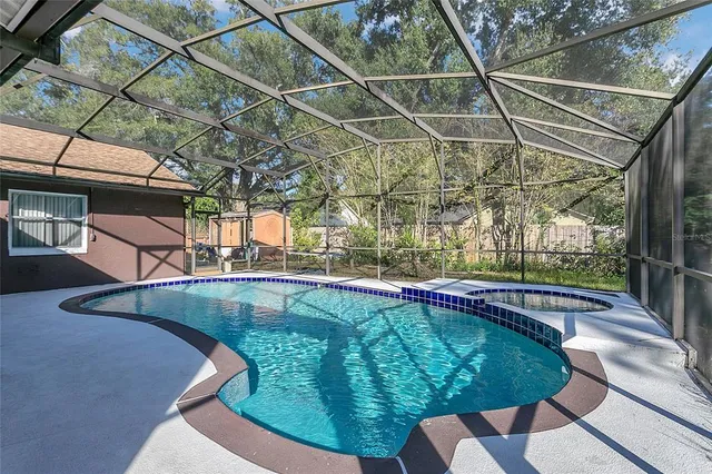a view of a swimming pool with a patio