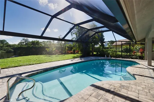 a view of swimming pool with a yard