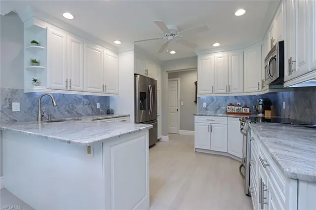 a kitchen with a sink stove and refrigerator