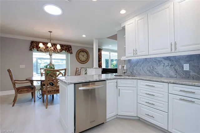 a kitchen with cabinets and window