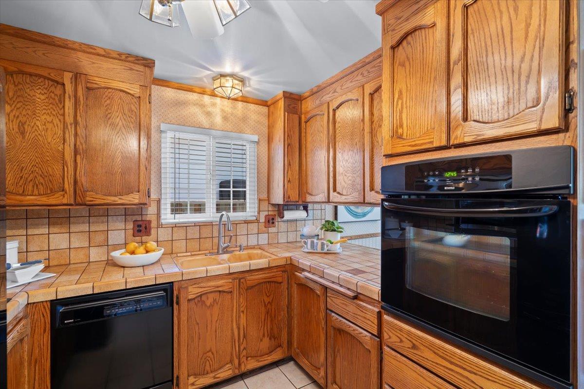 1470 Inskip Drive Campbell, CA 95008 - Photo 13 of 43 a kitchen with stainless steel appliances a stove sink and cabinets