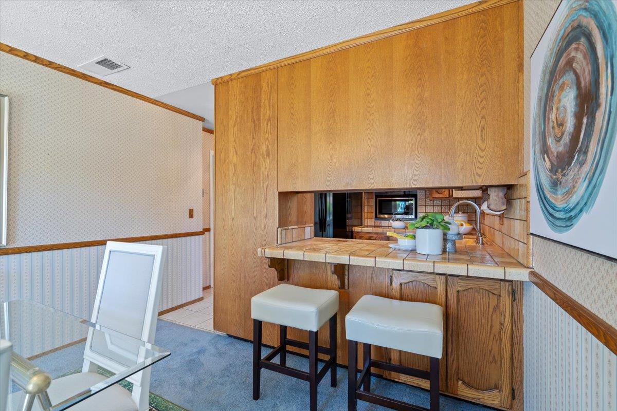 1470 Inskip Drive Campbell, CA 95008 - Photo 17 of 43 a dining room with furniture and a mirror