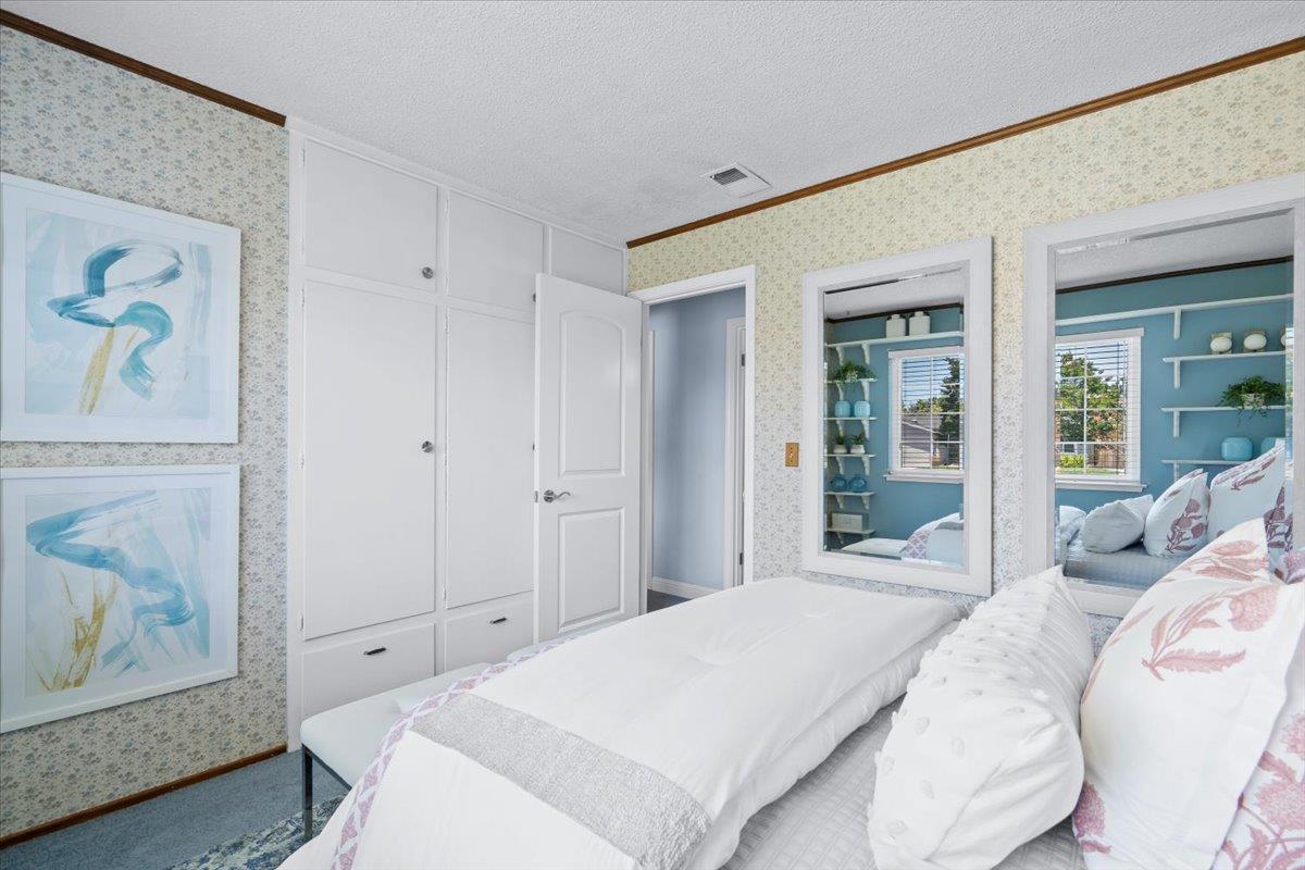 1470 Inskip Drive Campbell, CA 95008 - Photo 22 of 43 a bedroom with a bed and painting on the wall