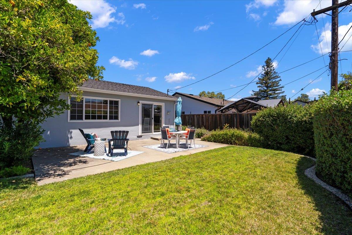 1470 Inskip Drive Campbell, CA 95008 - Photo 34 of 43 a view of a backyard with table and chairs potted plants and large tree