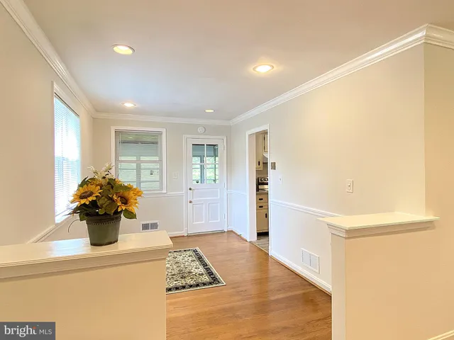 a kitchen with cabinets appliances a sink and a counter top space