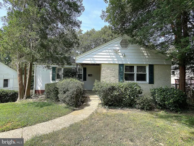 front view of a house with a garden