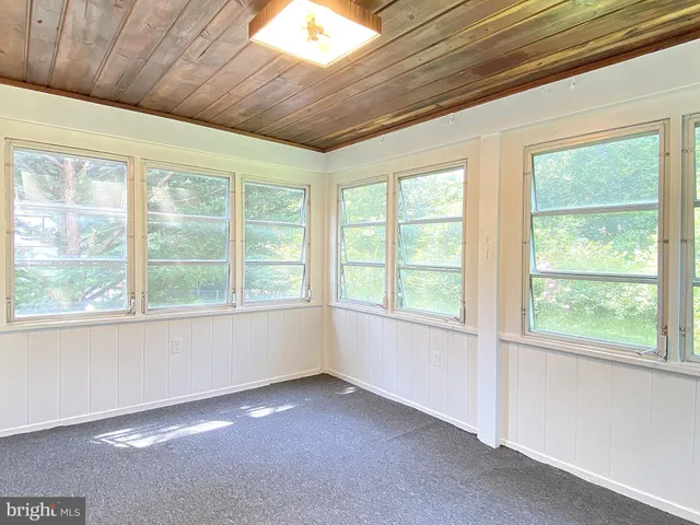 a bathroom with a large mirror and a shower
