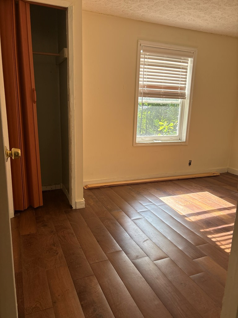 2910 Beech Street Columbus, GA 31909 - Photo 15 of 24 an empty room with wooden floor and windows