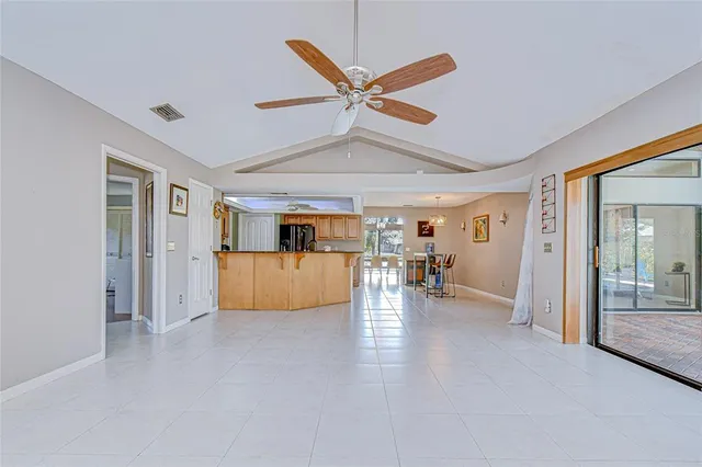 a view of a livingroom with furniture and a ceiling fan