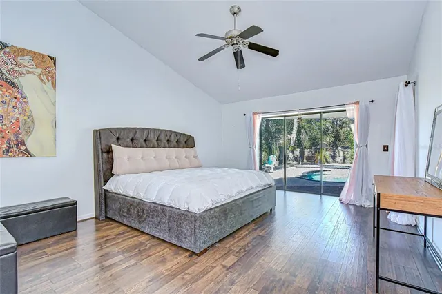 a bedroom with a large bed and a large window