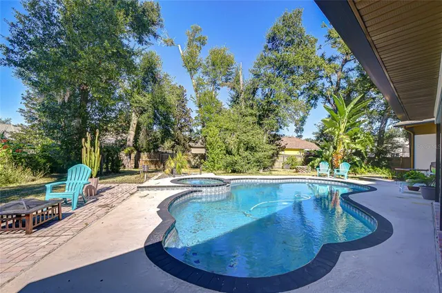 a view of a swimming pool with a yard