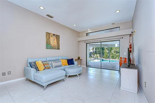 a living room with furniture and a large window