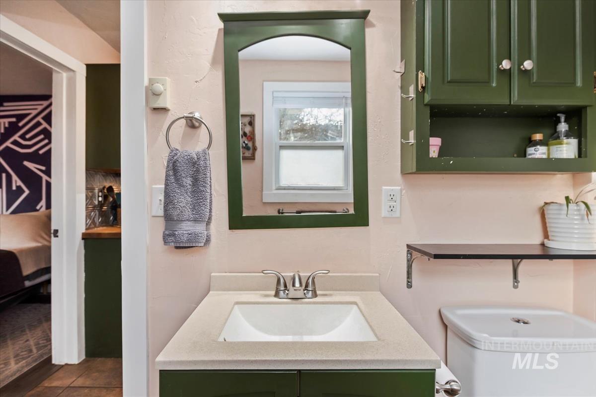 2837 Ona Street Boise, ID 83705 - Photo 22 of 26 Half bath with vanity and ensuite bathroom