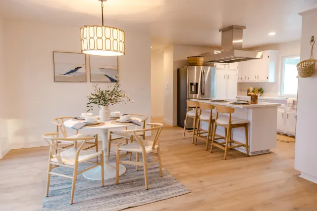 a view of a kitchen with white cabinets