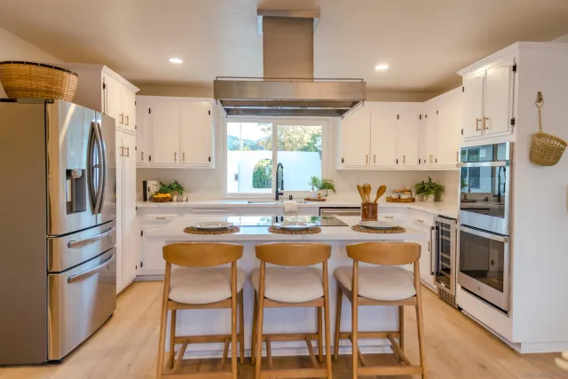 a living room with couch and a large window
