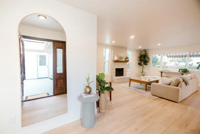 a living room with furniture and a large window