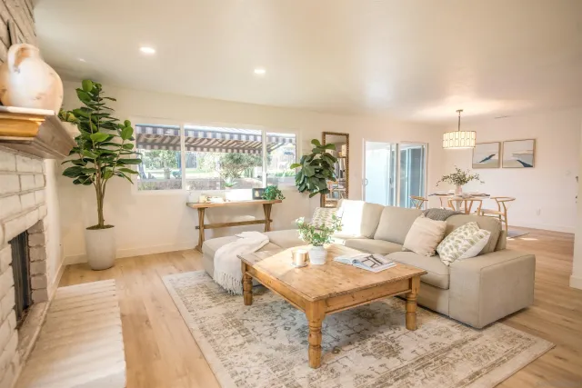 a view of a livingroom with a hardwood floor and a ceiling fan