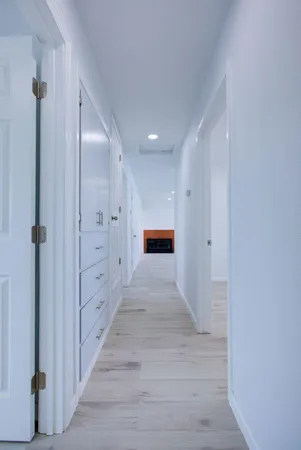 wooden floor in a hall with an entryway