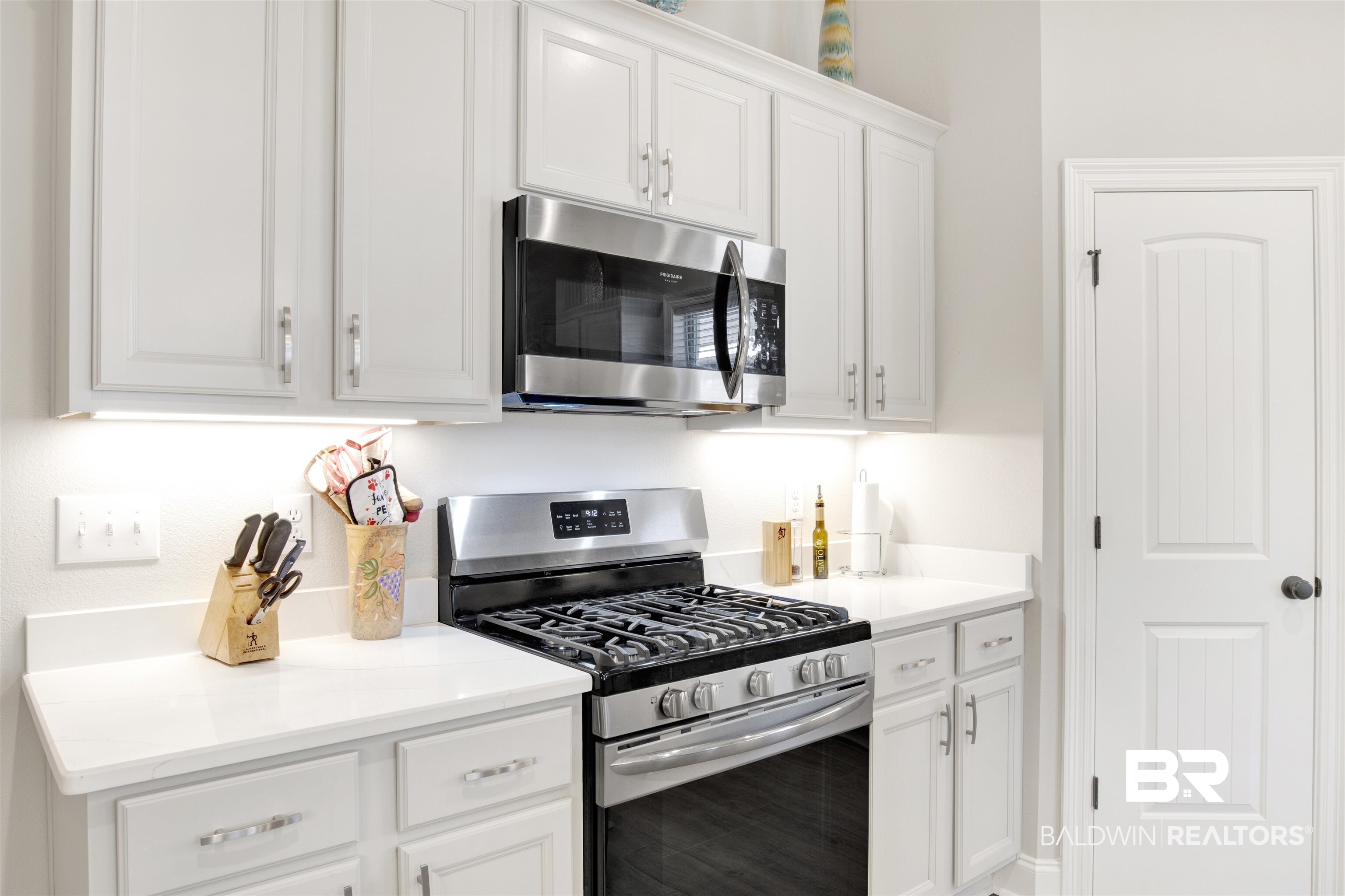 1406 Aldon Street Foley, AL 36535 - Photo 13 of 30 Kitchen featuring light gray cabinetry and appliances with stainless steel finishes.