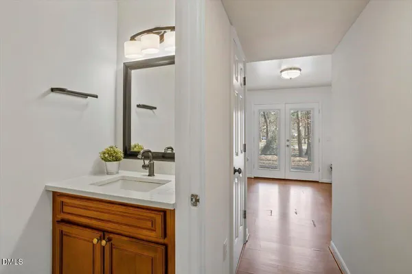 a bathroom with a sink and a mirror