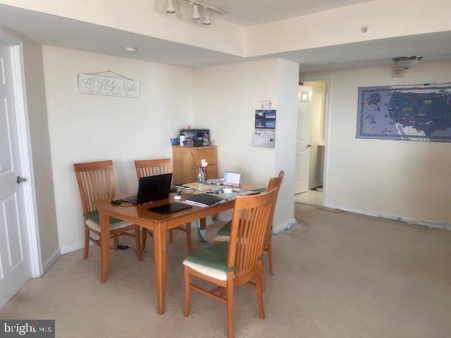 11710 Old Georgetown Road, Unit 602E Rockville, MD 20852 - Photo 11 of 22 a view of a dining room with furniture