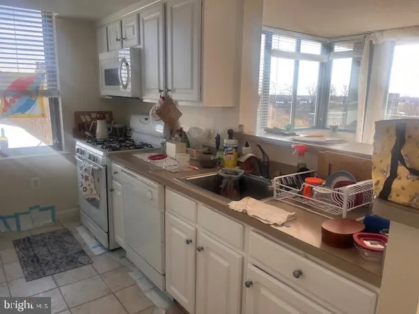 a kitchen with sink and cabinets