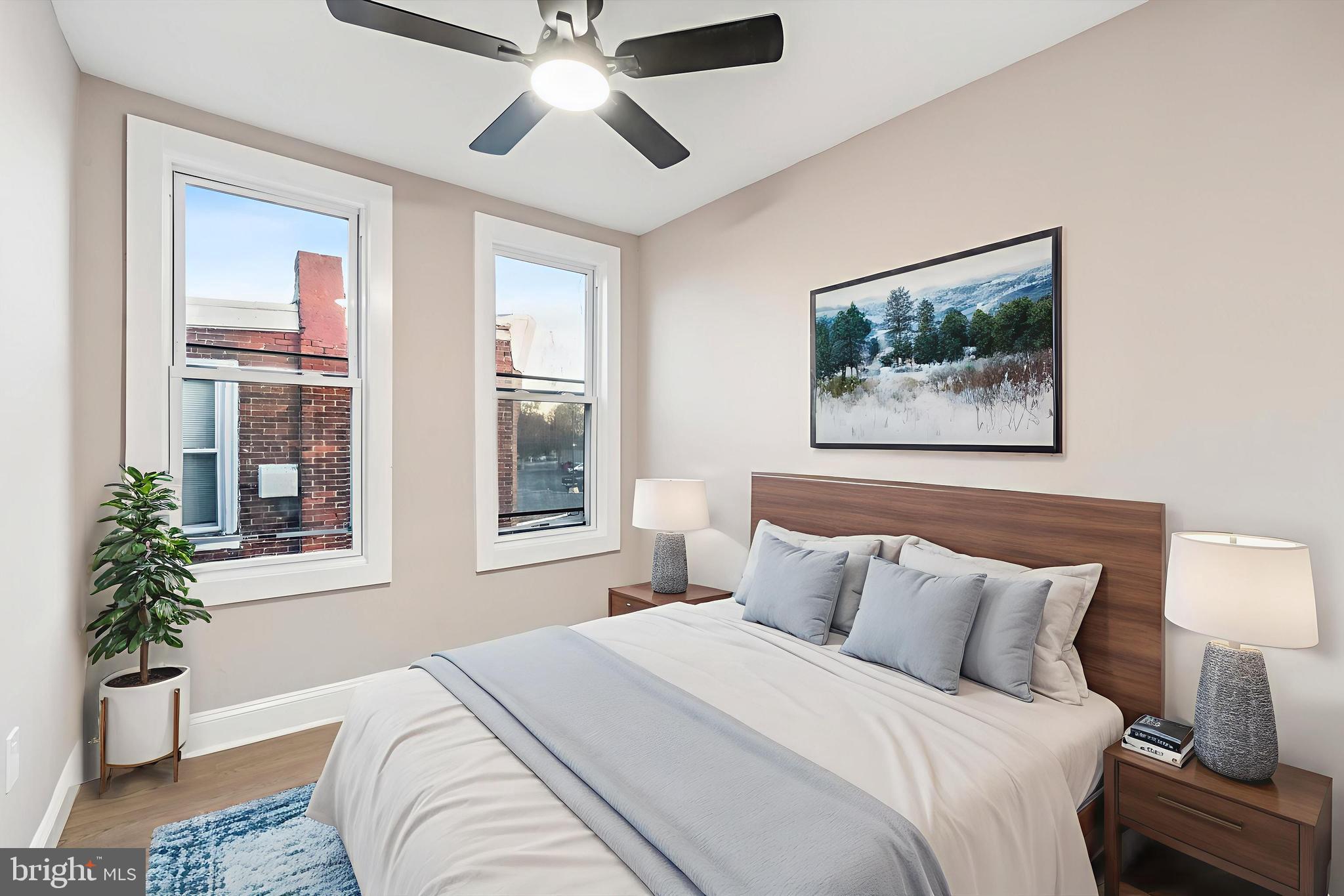 5614 Haverford Avenue Philadelphia, PA 19131 - Photo 13 of 19 a bedroom with a large bed and a chandelier