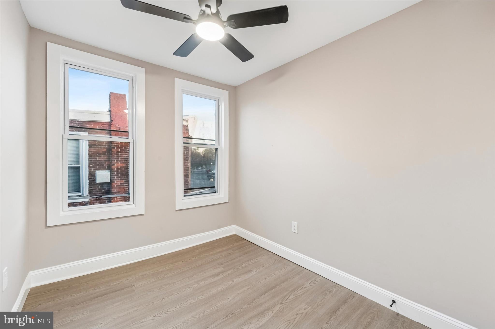 5614 Haverford Avenue Philadelphia, PA 19131 - Photo 14 of 19 an empty room with wooden floor fan and windows