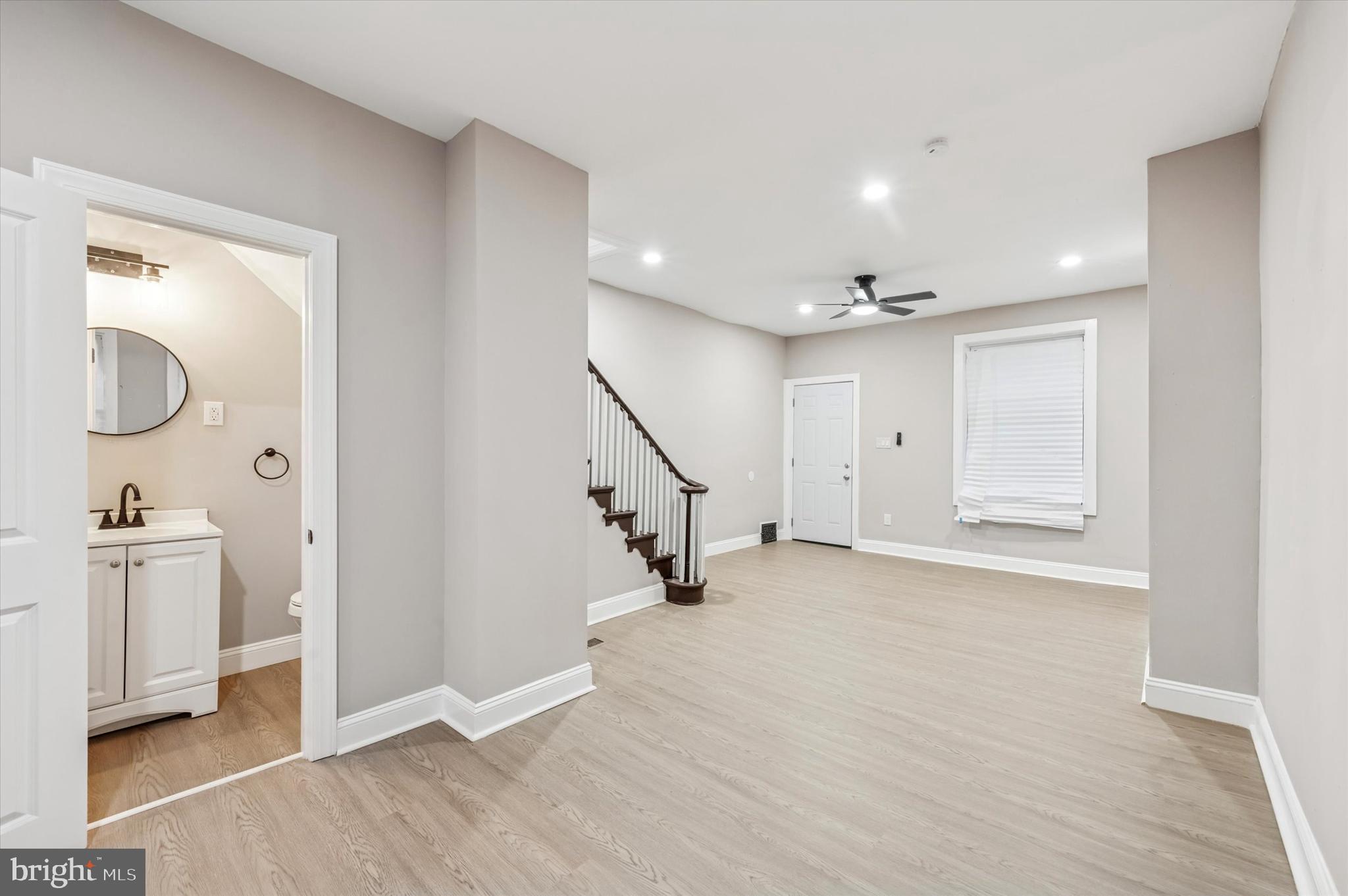 5614 Haverford Avenue Philadelphia, PA 19131 - Photo 9 of 19 a view of an empty room with wooden floor and a bathroom