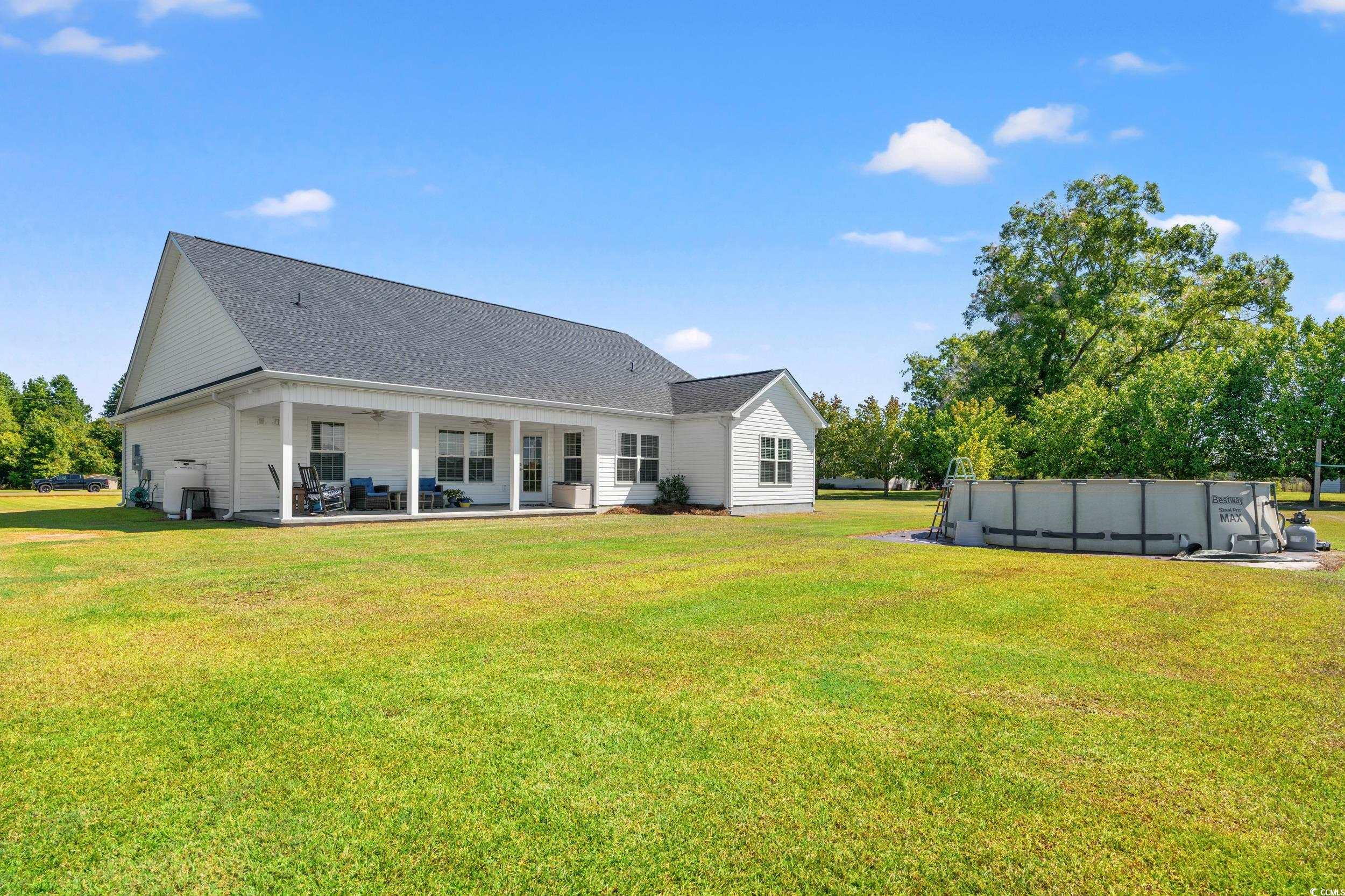 1333 Zion Road Aynor, SC 29544 - Photo 24 of 34 Back of house featuring a lawn and a patio area
