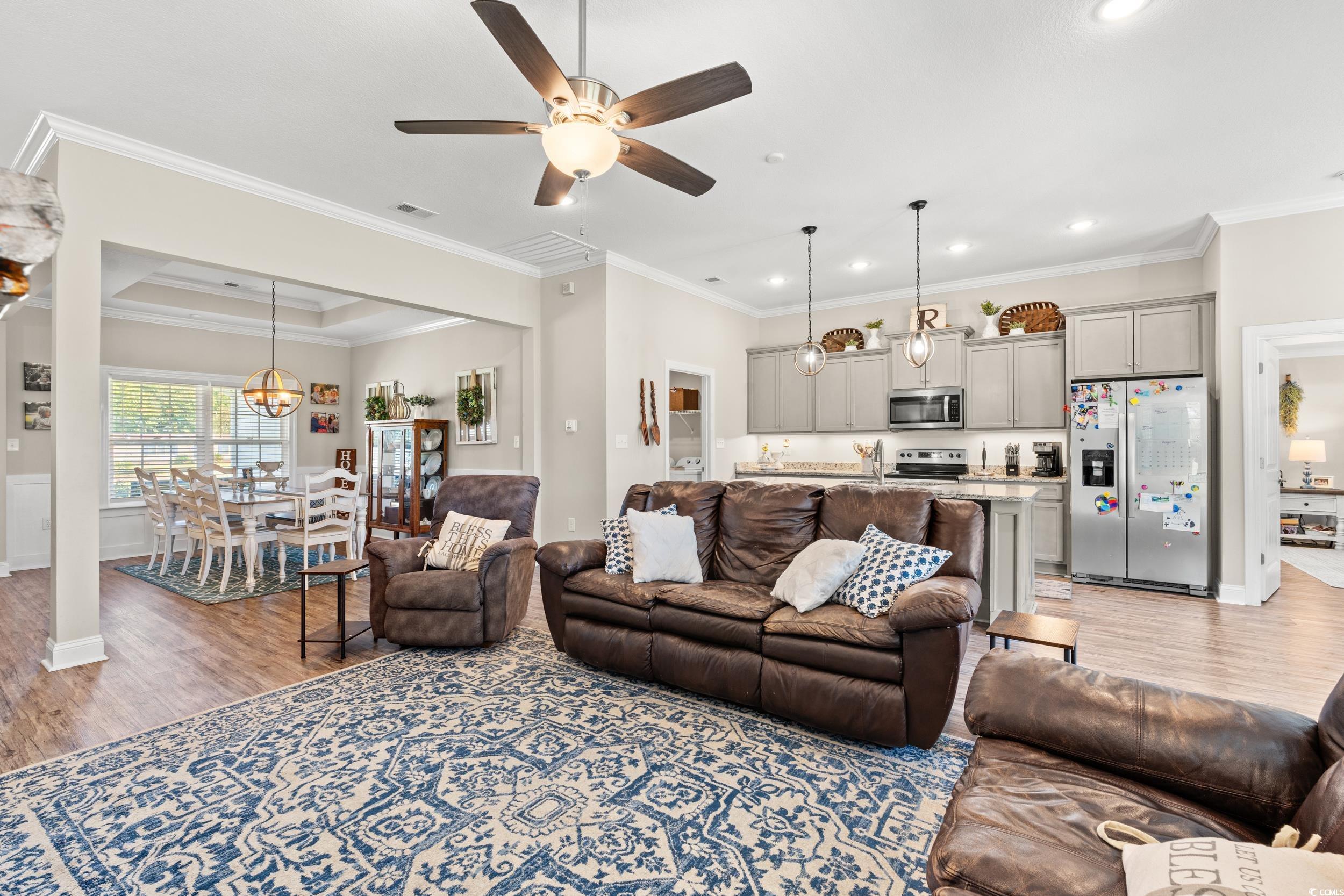 1333 Zion Road Aynor, SC 29544 - Photo 8 of 34 Living room featuring ornamental molding, a raised