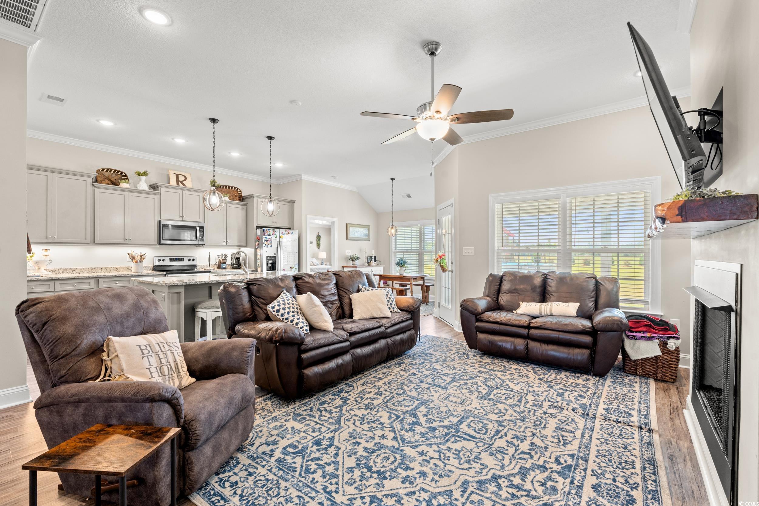 1333 Zion Road Aynor, SC 29544 - Photo 9 of 34 Living room with ornamental molding, light hardwoo
