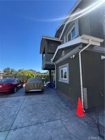a view of an outdoor space with parked cars